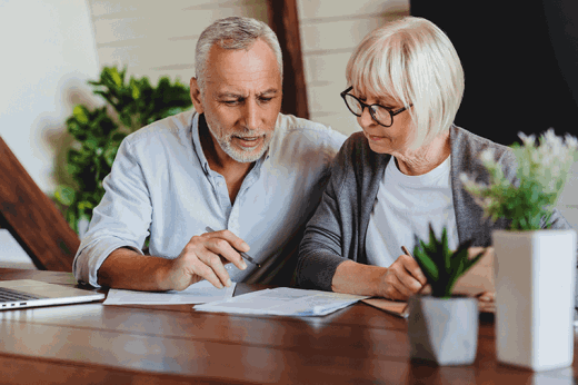 Senior-man-and-woman-do-monthly-paperwork