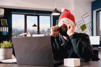 Stressed man with holiday cap